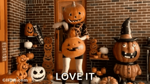 Woman Dressed As Pumpkin Holding Pumpkin GIF