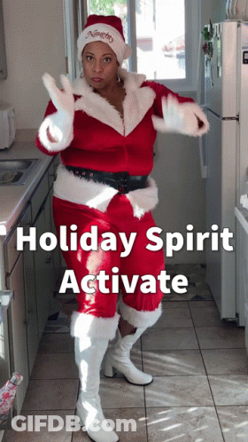 Woman Dressed As Santa Claus In Kitchen GIF
