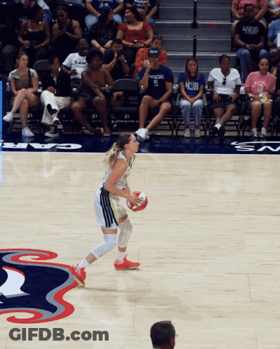 Woman Dribbling Basketball Past Man In HCJB Shirt GIF