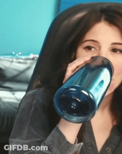Woman Drinking From Blue Bottle GIF