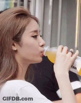 Woman Drinking From Bottle Saying Bia GIF