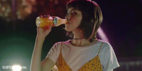 Woman Drinking From Fanta Bottle GIF
