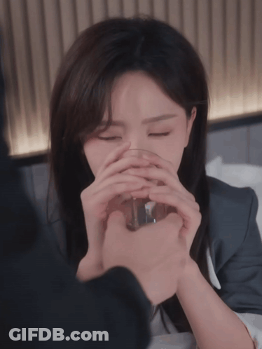 Woman Drinking From Glass Eyes Closed GIF