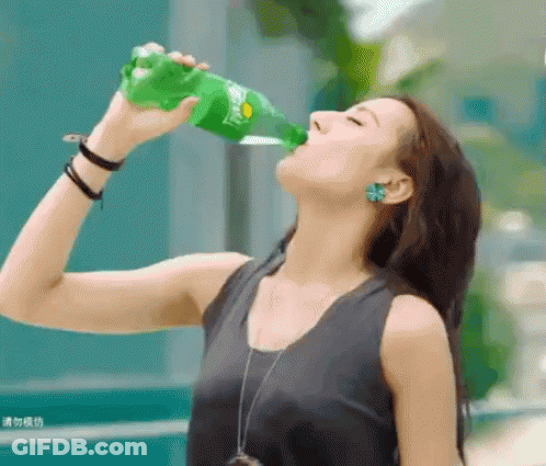 Woman Drinking From Green Sprite Bottle GIF