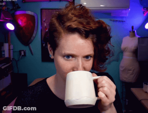 Woman Drinking From Mug With Submitted Watermark GIF
