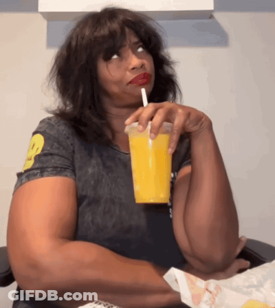 Woman Drinking Orange Juice With Straw GIF
