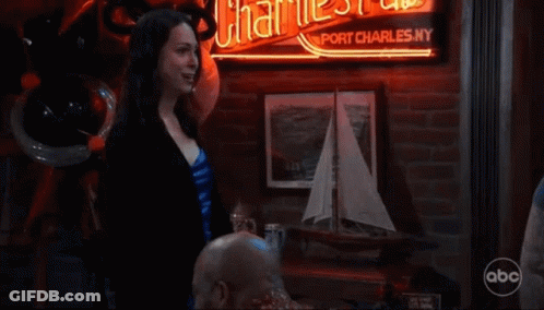 Woman Drinking Through Straw Next To Man GIF