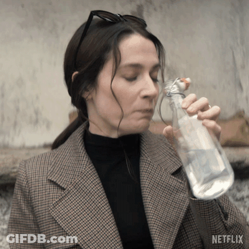 Woman Drinking Water From Bottle With Netflix Logo GIF