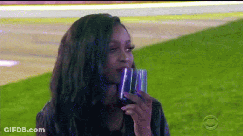Woman Drinking Water In Field GIF