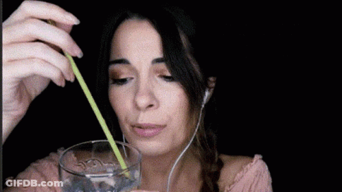 Woman Drinking Water With Straw And Headphones GIF