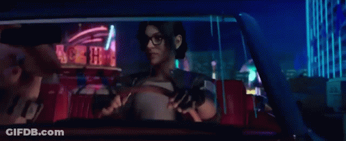 Woman Driving Car At Night Holding Gun GIF