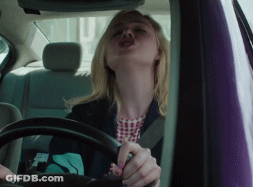 Woman Driving Car Making Funny Face GIF