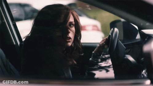 Woman Driving Car Talking On Phone GIF