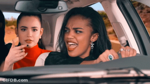 Woman Driving Car With Earrings Letter E GIF