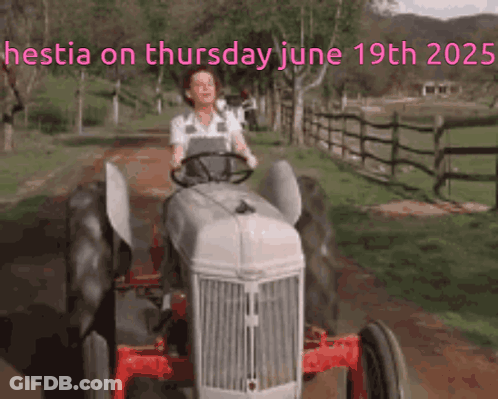 Woman Driving Tractor On Dirt Road June 19Th 2025 GIF
