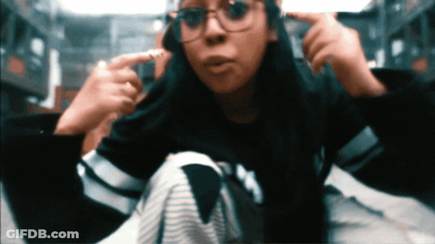 Woman Ear Plugs While Rapping GIF
