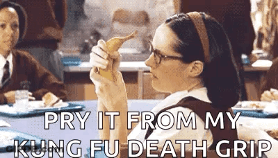 Woman Eating Banana Saying Pry It From My Kung Fu Death Grip GIF