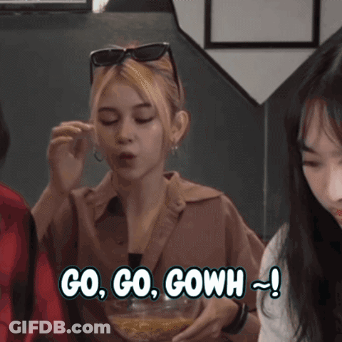 Woman Eating Bowl Of Food Saying Go Go Go GIF