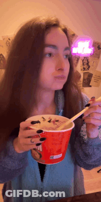 Woman Eating Bowl Of Food With Spoon GIF