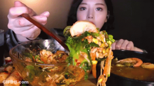 Woman Eating Bowl Of Food With Spoon GIF