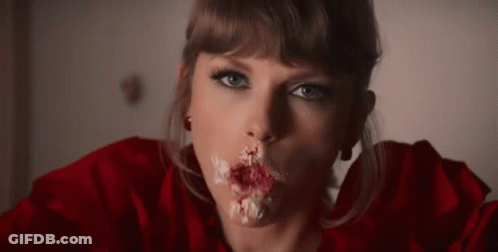 Woman Eating Cake With Icing On Mouth GIF
