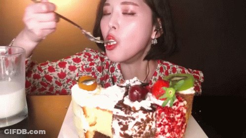 Woman Eating Cake With Spoon GIF