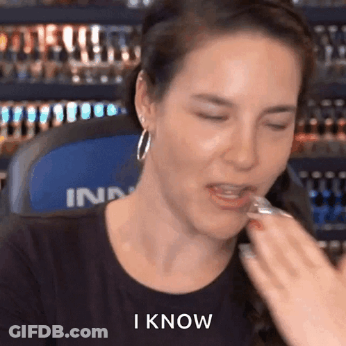 Woman Eating Candy Bar Saying I Know GIF