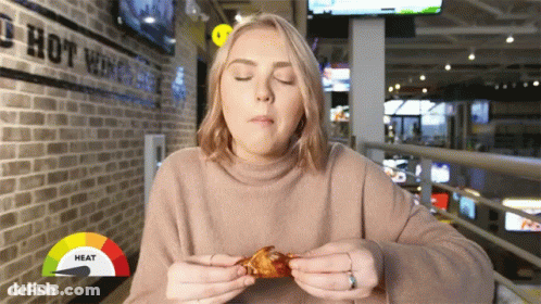 Woman Eating Chicken Wing GIF