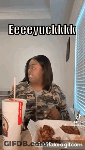 Woman Eating Chicken Wings And Drinking GIF