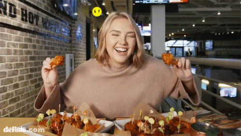 Woman Eating Chicken Wings GIF