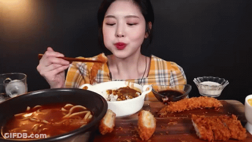 Woman Eating Curry With Chopsticks GIF