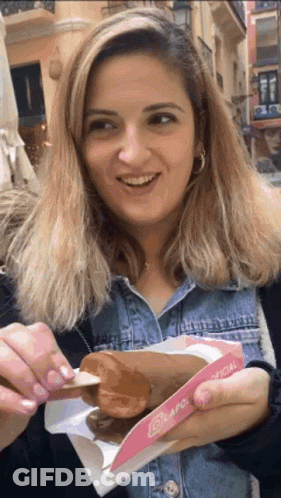 Woman Eating Donut From Lapol Oficial Box GIF