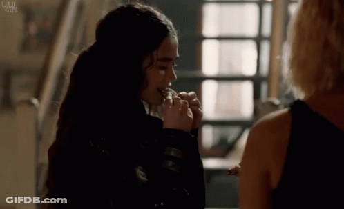 Woman Eating Food While Watching GIF