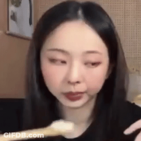 Woman Eating Food With Spoon GIF