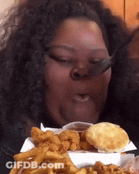 Woman Eating Fried Food With Fork GIF