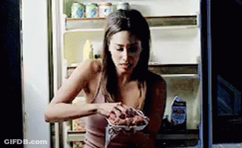 Woman Eating From Open Fridge GIF
