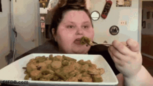 Woman Eating Green Beans With Fork GIF