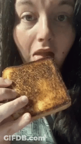 Woman Eating Grilled Cheese Sandwich GIF