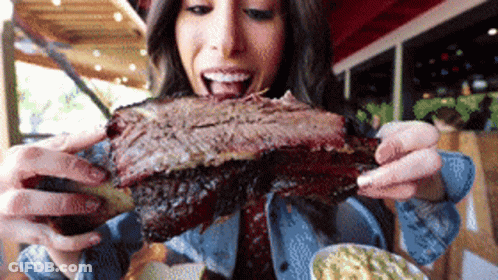 Woman Eating Huge Piece Of Meat GIF