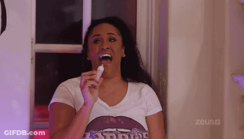 Woman Eating Ice Cream With Zeus Shirt GIF