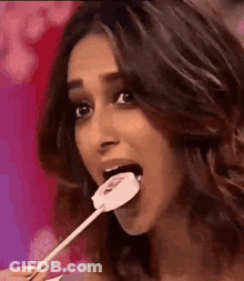 Woman Eating Lollipop With Mouth Open GIF