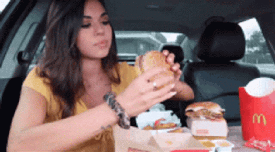 Woman Eating Mcdonalds Big Mac In Car GIF
