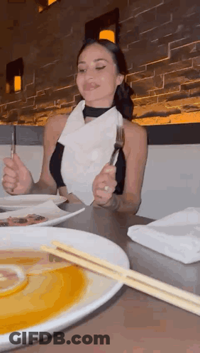 Woman Eating Meal With Chopsticks And Fork GIF