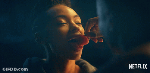 Woman Eating Meat With Netflix Logo GIF