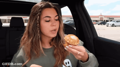 Woman Eating Muffin In Car Says Sissy Be Like Thanks Alot You Tasty Muffin Snake GIF
