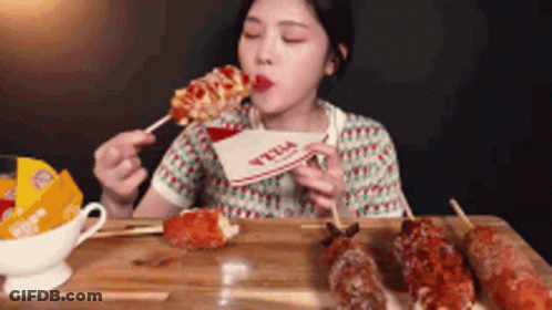 Woman Eating Pizza On A Stick GIF