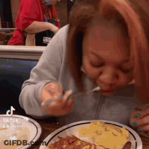 Woman Eating Pizza Slice With Fork GIF