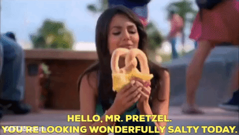 Woman Eating Pretzel Saying Hello Mr Pretzel GIF