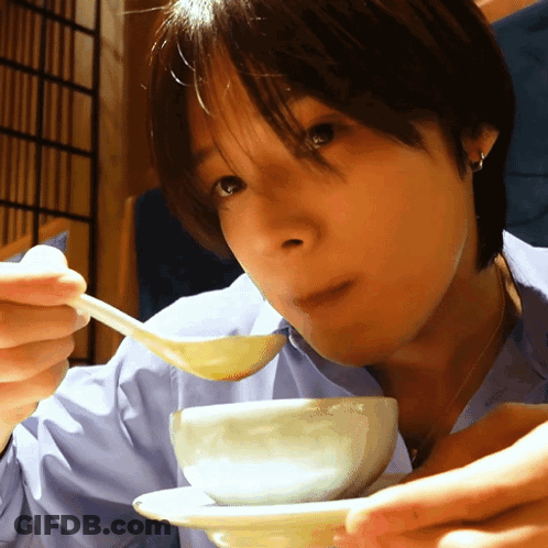 Woman Eating Something From Bowl With Spoon GIF