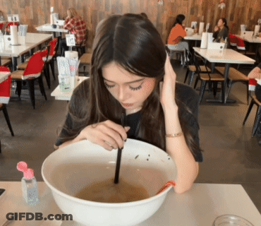 Woman Eating Soup With Chopsticks GIF